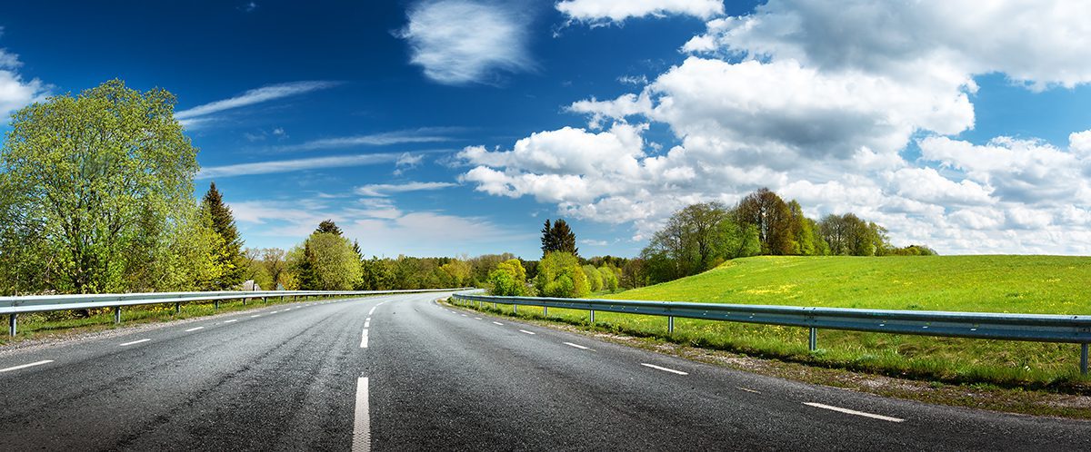 main, curved road into distance